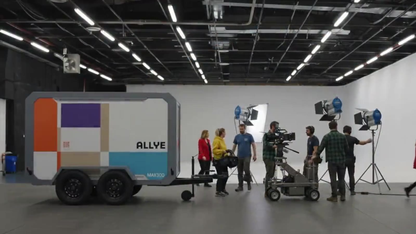 Allye MAX300 on its trailer in a film studio beside a camera crew